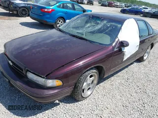 1995 Chevrolet Caprice z VIN 1G1BL52P1SR136345, wystawiony jako IAAI lot #42295367 z przebiegiem 37 725 mil mil oraz . Historia ofert i sprzedaży dostępna na DreamBid. Obrazek 2.