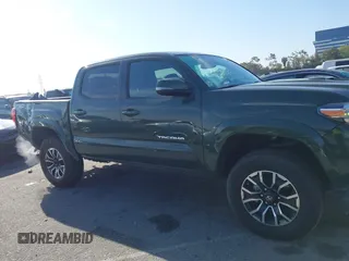 2021 Toyota Tacoma SR z VIN 3TMCZ5AN7MM395940, wystawiony jako IAAI lot #41860127 z przebiegiem 39 338 mil mil oraz . Historia ofert i sprzedaży dostępna na DreamBid. Obrazek 13.