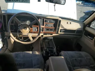 1993 Jeep Cherokee Country with VIN 1J4FJ78S0PL565292, listed as a Copart auction lot 83214974 with 233,925 mi miles and Clean Title. Bid and sale history available at carsss.com. Image 8.