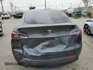 2025 Tesla Model Y Long Range with VIN 7SAYGDED4SF242721, listed as a Copart auction lot 56159955 with 7,131 mi miles and Salvage Title. Bid and sale history available at DreamBid. Image 6.