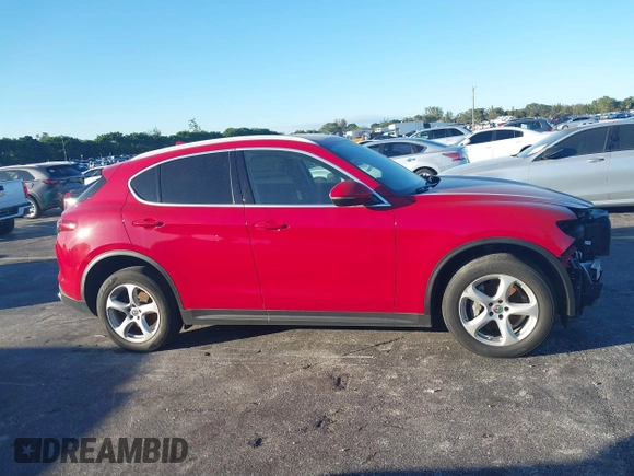 2018 Alfa Romeo Stelvio z VIN ZASFAKAN3J7C20066, wystawiony jako IAAI lot #40879859 z przebiegiem 50 131 mil mil oraz . Historia ofert i sprzedaży dostępna na DreamBid. Obrazek 14.