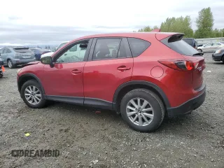 2015 Mazda CX-5 Touring with VIN JM3KE4CY2F0532871, listed as a Copart auction lot 55244375 with Not Provided miles and Salvage Title. Bid and sale history available at carsss.com. Image 2.