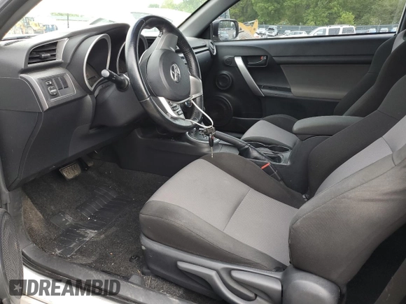 2014 Scion tC z VIN JTKJF5C70E3084411, wystawiony jako Copart lot #54255385 z przebiegiem 152 715 mil mil oraz Szkoda całkowita • Salvage title. Historia ofert i sprzedaży dostępna na DreamBid. Obrazek 7.