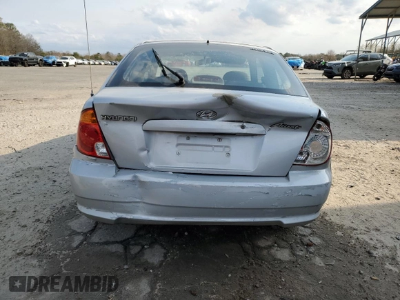 2003 Hyundai Accent GL z VIN KMHCG35CX3U270374, wystawiony jako Copart lot #47240325 z przebiegiem 122 739 mil mil oraz Szkoda całkowita • Salvage title. Historia ofert i sprzedaży dostępna na DreamBid. Obrazek 6.
