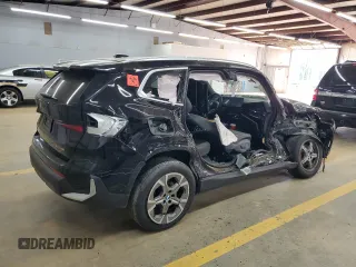 2023 BMW X1 xDrive28i with VIN WBX73EF07P5W50437, listed as a Copart auction lot 51064775 with 0 mi miles and Salvage Title. Bid and sale history available at carsss.com. Image 3.