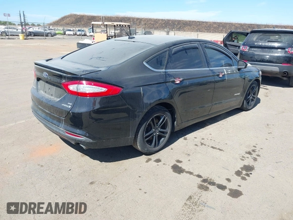 2016 Ford Fusion SE Hybrid z VIN 3FA6P0LU4GR260180, wystawiony jako IAAI lot #42508932 z przebiegiem 97 475 mil mil oraz . Historia ofert i sprzedaży dostępna na DreamBid. Obrazek 4.
