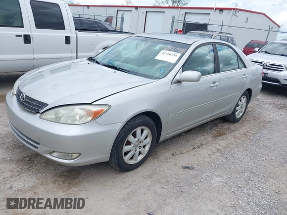 2003 Toyota Camry LE with VIN 4T1BE30K13U168509, listed as a IAAI auction lot 42220735 with 210,328 mi miles and . Bid and sale history available at DreamBid. Image 2.