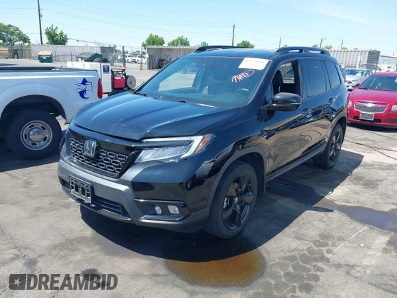 2021 Honda Passport Elite with VIN 5FNYF8H07MB003506, listed as a IAAI auction lot 42571906 with 42,323 mi miles and . Bid and sale history available at DreamBid. Image 18.