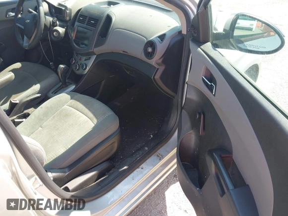2013 Chevrolet Sonic LS with VIN 1G1JA5SH1D4246936, listed as a IAAI auction lot 42665664 with 124,464 mi miles and . Bid and sale history available at DreamBid. Image 5.
