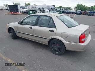 2000 Mazda Protege DX with VIN JM1BJ2227Y0237323, listed as a IAAI auction lot 42179683 with Not Provided miles and . Bid and sale history available at DreamBid. Image 3.