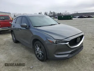 2019 Mazda CX-5 Signature with VIN JM3KFBEY3K0609305, listed as a Copart auction lot 44146455 with 33,104 mi miles and Salvage Title. Bid and sale history available at carsss.com. Image 4.