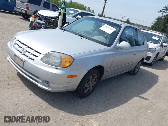 2005 Hyundai Accent GLS with VIN KMHCG35C65U332999, listed as a IAAI auction lot 42097932 with 225,593 mi miles. Bid and sale history available at carsss.com. Image 2.