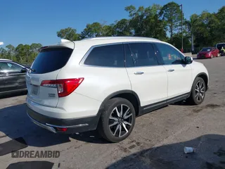 2019 Honda Pilot Touring 8-Passenger z VIN 5FNYF6H98KB016992, wystawiony jako IAAI lot #42275295 z przebiegiem 82 154 mil mil oraz . Historia ofert i sprzedaży dostępna na DreamBid. Obrazek 4.
