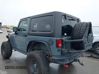 2013 Jeep Wrangler Rubicon 10th Anniversary with VIN 1C4BJWCG2DL651815, listed as a IAAI auction lot 41643919 with 98,297 mi miles and . Bid and sale history available at DreamBid. Image 3.
