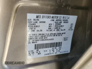 2004 Ford F-150 XLT z VIN 1FTRW12W64KA34323, wystawiony jako Copart lot #65196405 z przebiegiem 170 724 mil mil oraz Szkoda całkowita • Salvage title. Historia ofert i sprzedaży dostępna na DreamBid. Obrazek 13.