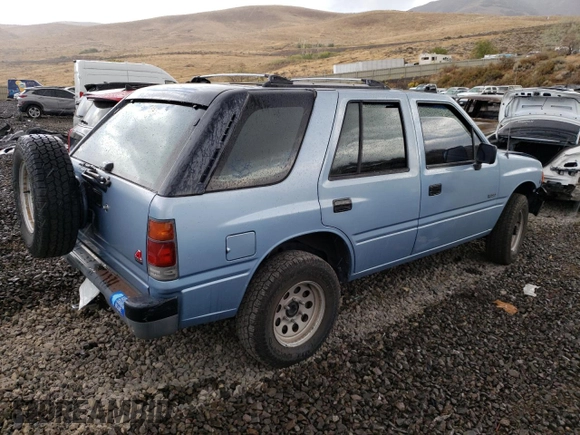 1992 Isuzu Rodeo z VIN 4S2CY58Z2N4333410, wystawiony jako Copart lot #74507154 z przebiegiem 264 327 mil mil oraz Szkody całkowita. Historia ofert i sprzedaży dostępna na DreamBid. Obrazek 3.