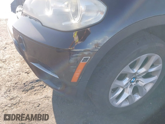 2012 BMW X5 35i z VIN 5UXZV4C50CL744724, wystawiony jako IAAI lot #41635239 z przebiegiem 166 363 mil mil oraz . Historia ofert i sprzedaży dostępna na DreamBid. Obrazek 12.