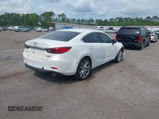 2014 Mazda 6 i Touring with VIN JM1GJ1V64E1142643, listed as a IAAI auction lot 42229322 with 215,095 mi miles and . Bid and sale history available at DreamBid. Image 4.