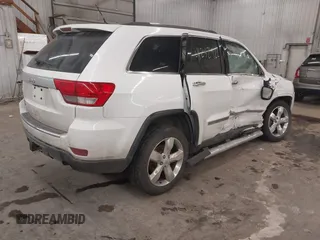 2013 Jeep Grand Cherokee Overland with VIN 1C4RJFCG7DC581808, listed as a IAAI auction lot 41242922 with 187,442 mi miles. Bid and sale history available at carsss.com. Image 4.