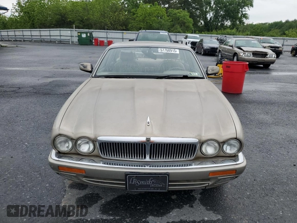 1995 Jaguar XJ with VIN SAJHX174XSC738856, listed as a Copart auction lot 57768915 with Not provided miles and Salvage title. Bid and sale history available at DreamBid. Image 5.