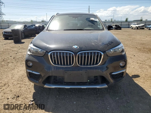 2018 BMW X1 xDrive28i with VIN WBXHT3C38J5K28174, listed as a Copart auction lot 57333385 with 50,064 mi miles and Salvage title. Bid and sale history available at DreamBid. Image 5.