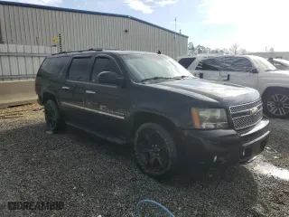 2011 Chevrolet Suburban LTZ with VIN 1GNSKKE38BR228173, listed as a Copart auction lot 49647385 with 225,700 mi miles and Salvage Title. Bid and sale history available at carsss.com. Image 4.