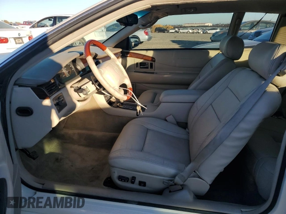 2002 Cadillac Eldorado z VIN 1G6EL12Y12B100821, wystawiony jako Copart lot #83495214 z przebiegiem 36 358 mil mil oraz Czysty tytuł • Clean title. Historia ofert i sprzedaży dostępna na DreamBid. Obrazek 7.