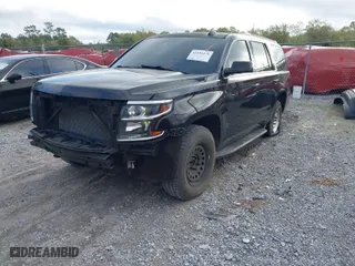 2015 Chevrolet Tahoe LT with VIN 1GNSCBKCXFR687597, listed as a IAAI auction lot 41935279 with 213,290 mi miles. Bid and sale history available at carsss.com. Image 2.