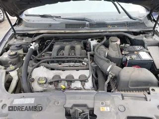 2011 Ford Taurus SE with VIN 1FAHP2DW7BG128857, listed as a IAAI auction lot 41705643 with 163,589 mi miles. Bid and sale history available at carsss.com. Image 10.
