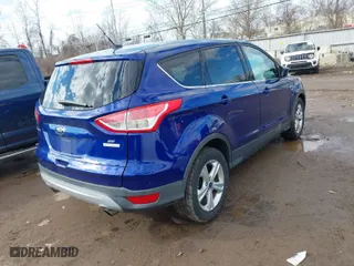 2014 Ford Escape SE with VIN 1FMCU0GX4EUD86535, listed as a IAAI auction lot 41650461 with 96,937 mi miles. Bid and sale history available at carsss.com. Image 4.