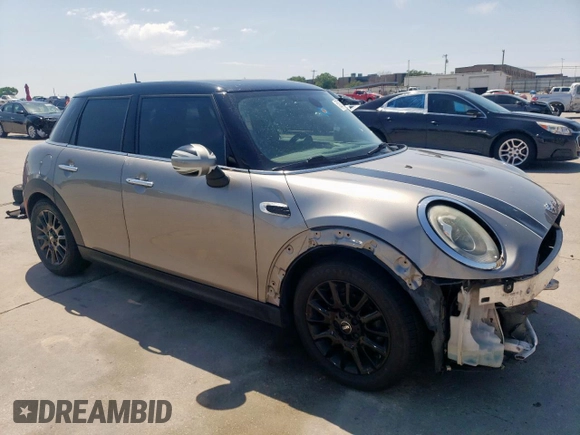 2017 MINI Hardtop 4 Door Cooper with VIN WMWXU1C53H2E18438, listed as a Copart auction lot 52871475 with 133,235 mi miles and Salvage Title. Bid and sale history available at DreamBid. Image 4.