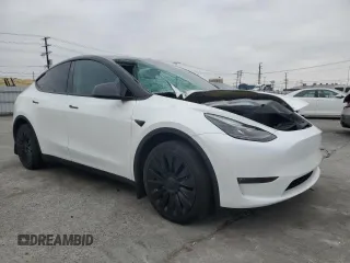 2023 Tesla Model Y Long Range with VIN 7SAYGDEE2PF860135, listed as a Copart auction lot 50380975 with 25,334 mi miles and Salvage Title. Bid and sale history available at DreamBid. Image 4.