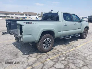 2022 Toyota Tacoma SR5 with VIN 3TMBZ5DN1NM035572, listed as a IAAI auction lot 42083925 with 82,596 mi miles and . Bid and sale history available at DreamBid. Image 4.