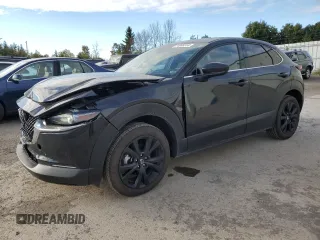2023 Mazda CX-30 Premium with VIN 3MVDMBDY1PM585694, listed as a Copart auction lot 74969314 with 9,740 mi miles and Salvage title. Bid and sale history available at DreamBid. Image 1.