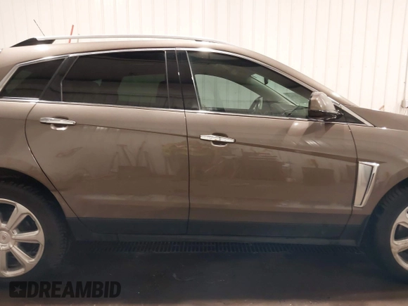 2014 Cadillac SRX Performance Collection z VIN 3GYFNFE38ES578066, wystawiony jako IAAI lot #42153023 z przebiegiem 134 009 mil mil oraz . Historia ofert i sprzedaży dostępna na DreamBid. Obrazek 14.