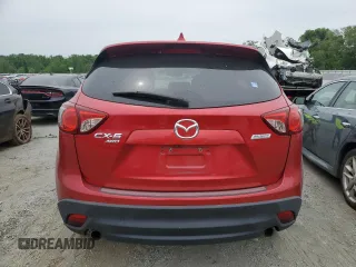 2014 Mazda CX-5 Touring z VIN JM3KE4CY3E0382106, wystawiony jako Copart lot #55521645 z przebiegiem 84 539 mil mil oraz Szkoda całkowita • Salvage title. Historia ofert i sprzedaży dostępna na DreamBid. Obrazek 6.