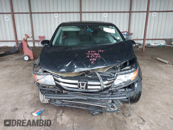 2014 Honda Odyssey Touring with VIN 5FNRL5H98EB095835, listed as a IAAI auction lot 42153412 with 124,131 mi miles and . Bid and sale history available at DreamBid. Image 13.