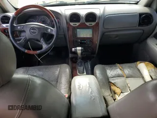 2005 GMC Envoy Denali z VIN 1GKES63MX52321416, wystawiony jako Copart lot #57587575 z przebiegiem 252 571 mil mil oraz Szkody całkowita. Historia ofert i sprzedaży dostępna na DreamBid. Obrazek 8.