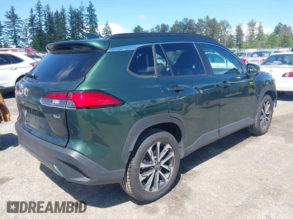 2023 Toyota Corolla Cross XLE with VIN 7MUEAAAG6PV052816, listed as a IAAI auction lot 42386639 with 42,736 mi miles and . Bid and sale history available at DreamBid. Image 4.