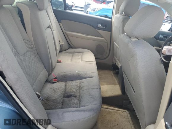 2012 Ford Fusion SE z VIN 3FAHP0HA1CR372744, wystawiony jako Copart lot #59118315 z przebiegiem Nie podano mil oraz Szkoda całkowita • Salvage title. Historia ofert i sprzedaży dostępna na DreamBid. Obrazek 10.