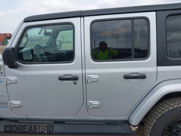 2023 Jeep Wrangler Sahara with VIN 1C4JJXP62PW627455, listed as a IAAI auction lot 42115137 with 62,143 mi miles and . Bid and sale history available at DreamBid. Image 14.