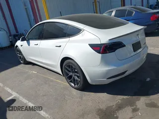 2020 Tesla Model 3 Standard Range Plus with VIN 5YJ3E1EA1LF659765, listed as a IAAI auction lot 41834411 with 42,433 mi miles and . Bid and sale history available at carsss.com. Image 3.