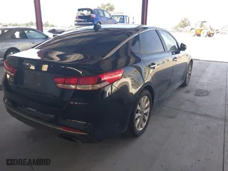 2016 Kia Optima LX with VIN 5XXGT4L33GG064125, listed as a IAAI auction lot 39506983 with 131,976 mi miles. Bid and sale history available at carsss.com. Image 4.