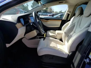 2018 Tesla Model X 75D with VIN 5YJXCBE22JF111938, listed as a Copart auction lot 47000303 with 63,430 mi miles. Bid and sale history available at carsss.com. Image 7.