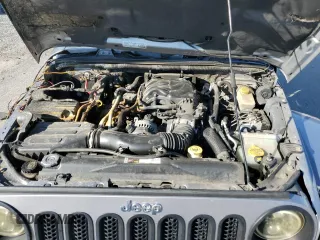 2015 Jeep Wrangler Unlimited Wrangler X with VIN 1C4BJWEG7FL580885, listed as a Copart auction lot 48891605 with 104,448 mi miles and Salvage title. Bid and sale history available at DreamBid. Image 11.