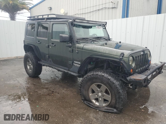 2012 Jeep Wrangler Unlimited Sport with VIN 1C4HJWDG8CL122067, listed as a Copart auction lot 58549805 with 124,658 mi miles and Clean title. Bid and sale history available at DreamBid. Image 4.