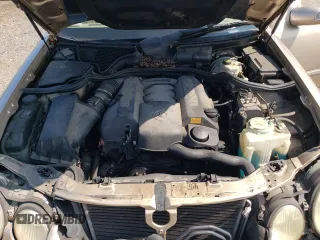 2000 Mercedes-Benz E-Class with VIN WDBJF65J2YB165568, listed as a Copart auction lot 70003994 with 146,518 mi miles and Salvage Title. Bid and sale history available at carsss.com. Image 11.