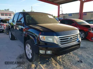 2012 Honda Ridgeline RTL with VIN 5FPYK1F51CB452400, listed as a IAAI auction lot 41853497 with 157,131 mi miles. Bid and sale history available at carsss.com. Image 1.