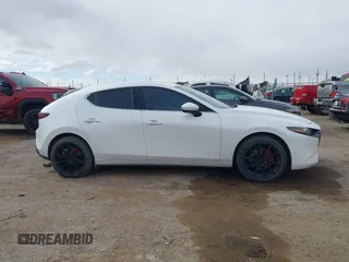 2021 Mazda 3 Premium with VIN JM1BPAML0M1302385, listed as a IAAI auction lot 41397521 with 55,907 mi miles and . Bid and sale history available at DreamBid. Image 12.
