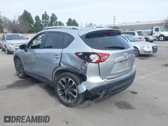 2016 Mazda CX-5 Grand Touring with VIN JM3KE2DY9G0723921, listed as a IAAI auction lot 41681522 with 83,893 mi miles. Bid and sale history available at carsss.com. Image 6.